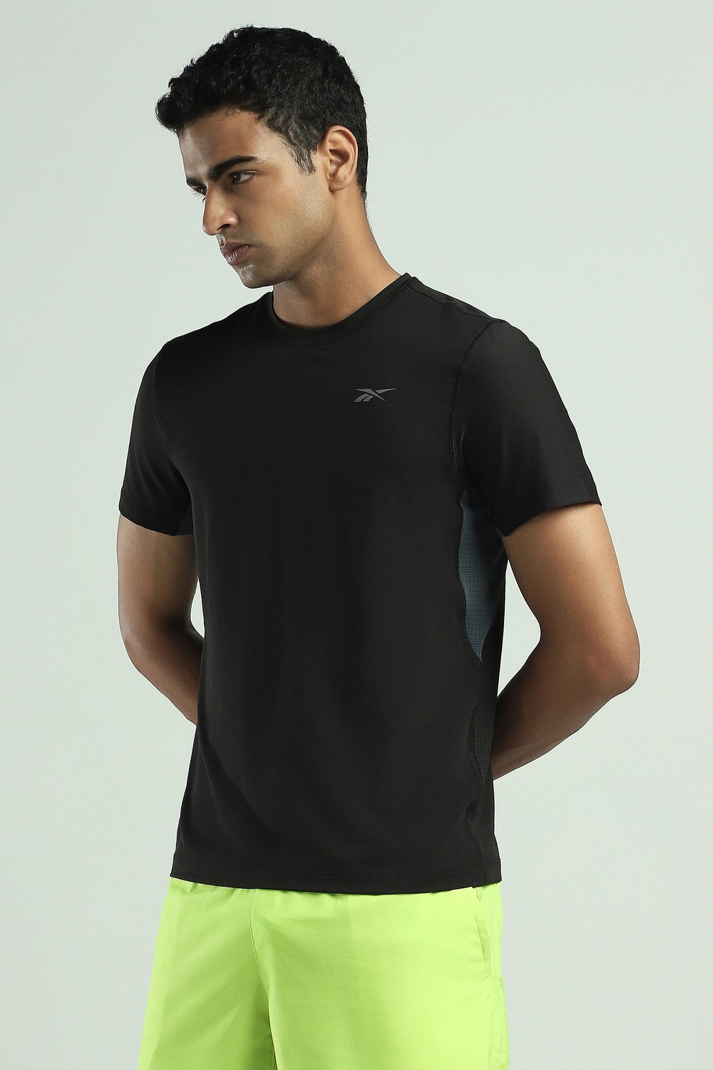 Image of REEBOK Solid Men Round Neck Black T-Shirt