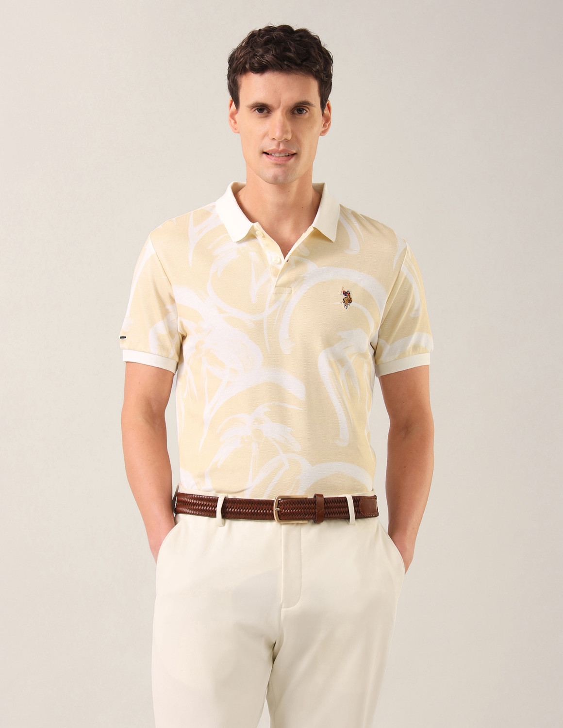 Image of U.S. Polo Assn. Denim Co. Men Printed Polo Neck Pure Cotton Beige T-Shirt