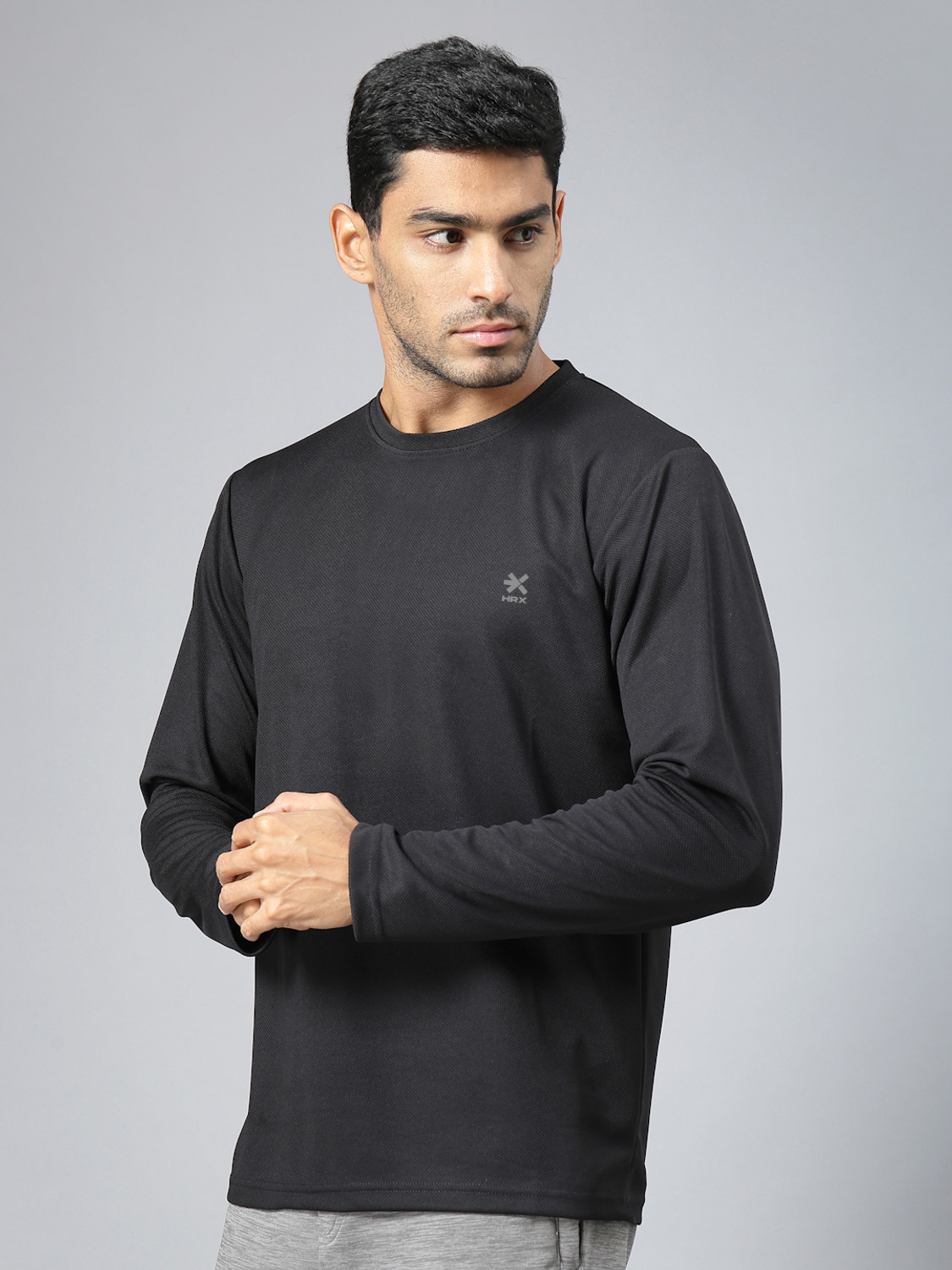 Image of HRX by Hrithik Roshan Solid Men Round Neck Black T-Shirt