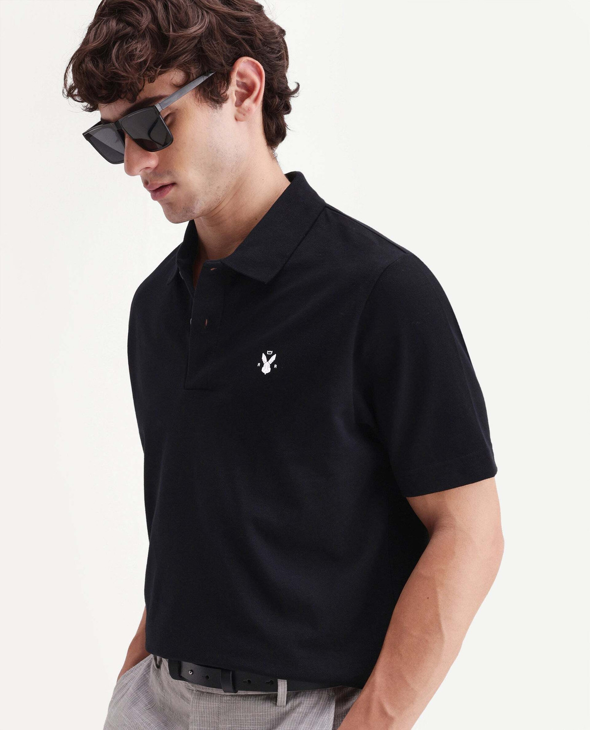 Image of RARE RABBIT Solid Men Polo Neck Black T-Shirt