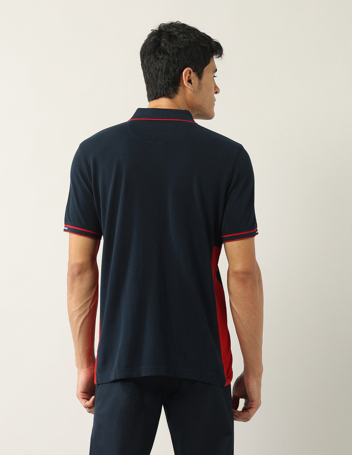 Image of Arrow Sport Solid, Colorblock Men Polo Neck Blue T-Shirt