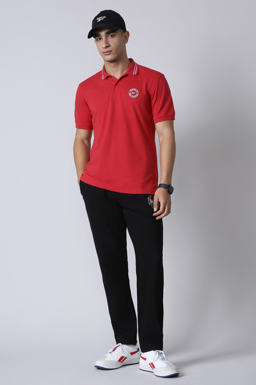 Image of REEBOK Men Solid Polo Neck Polyester Red T-Shirt
