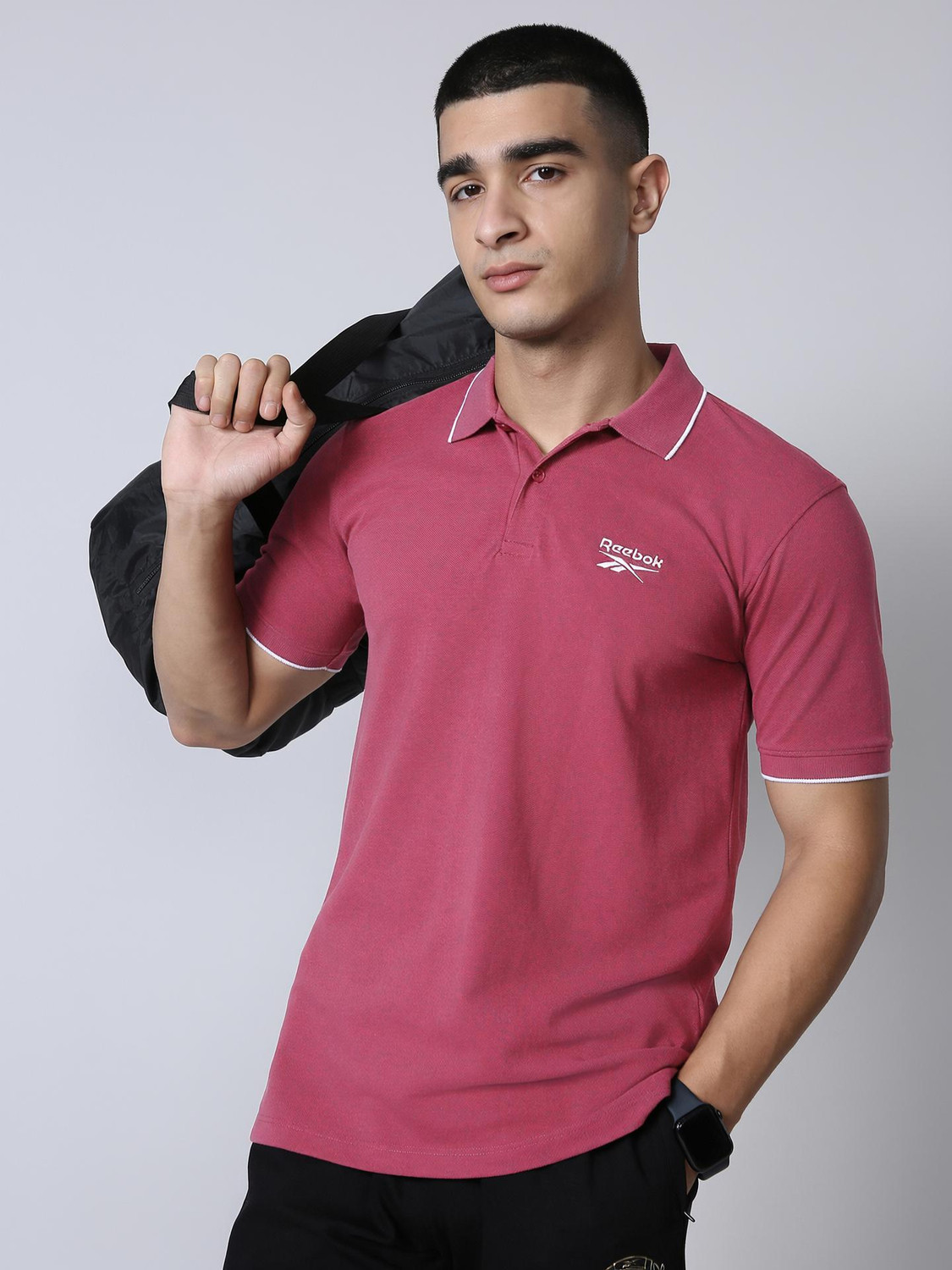Image of REEBOK Men Solid Polo Neck Polyester Red T-Shirt