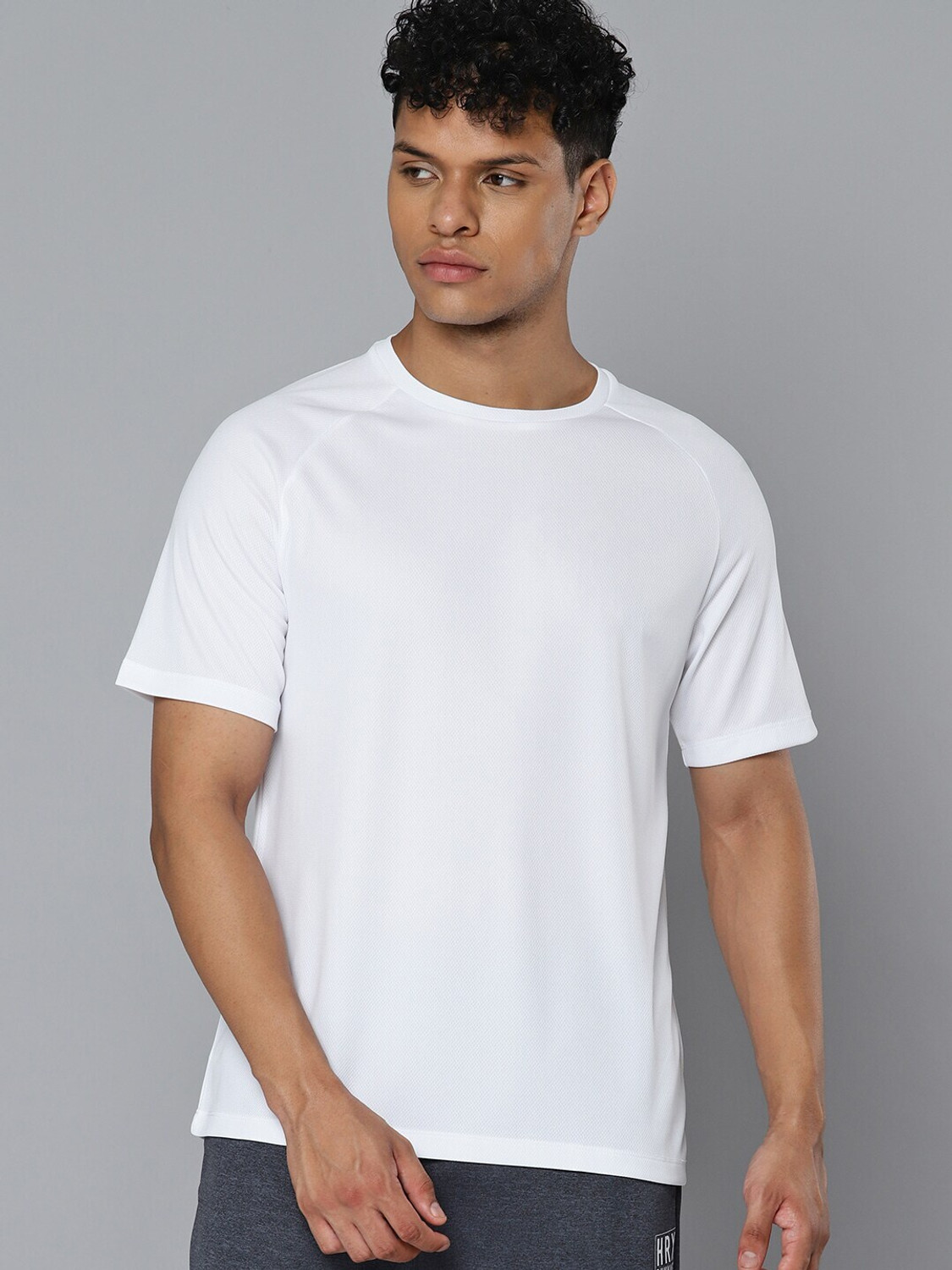 Image of HRX by Hrithik Roshan Men Solid Round Neck Polyester White T-Shirt
