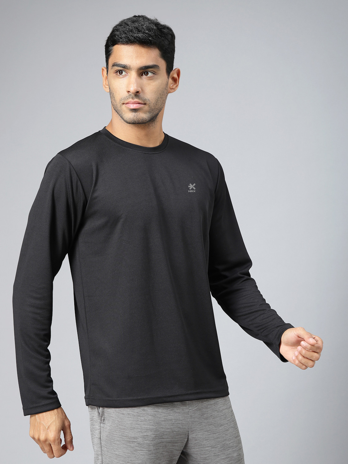 Image of HRX by Hrithik Roshan Solid Men Round Neck Black T-Shirt
