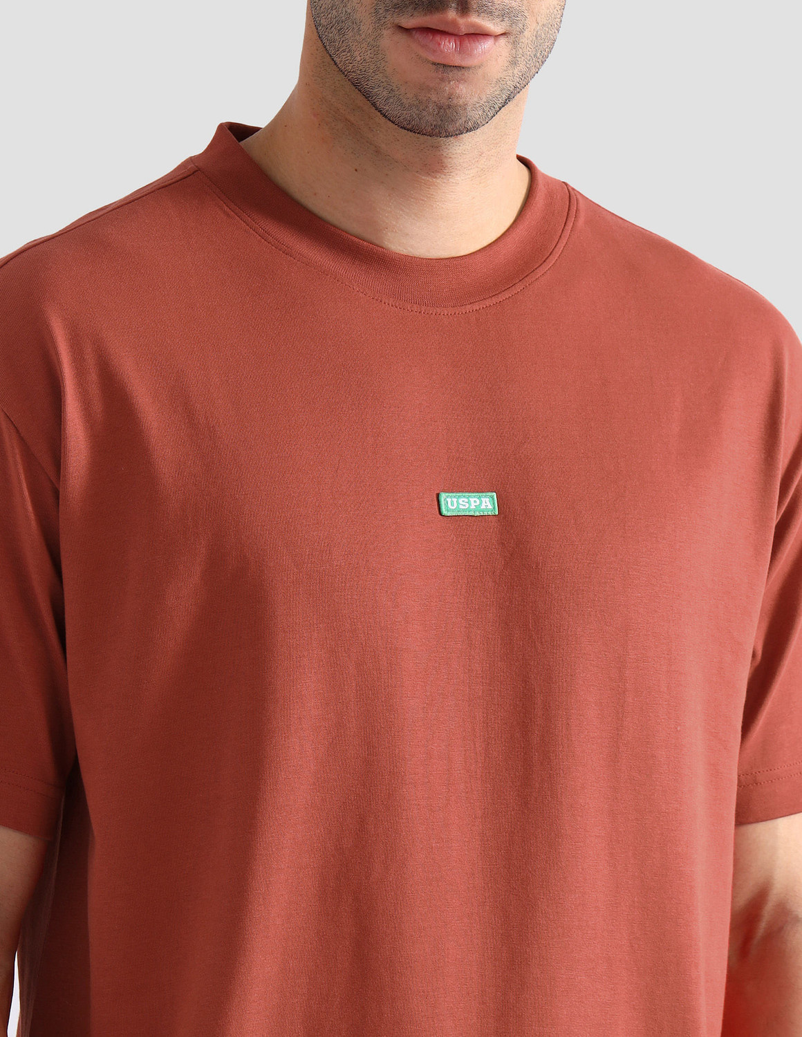 Image of U.S. POLO ASSN. Solid Men Crew Neck Orange T-Shirt