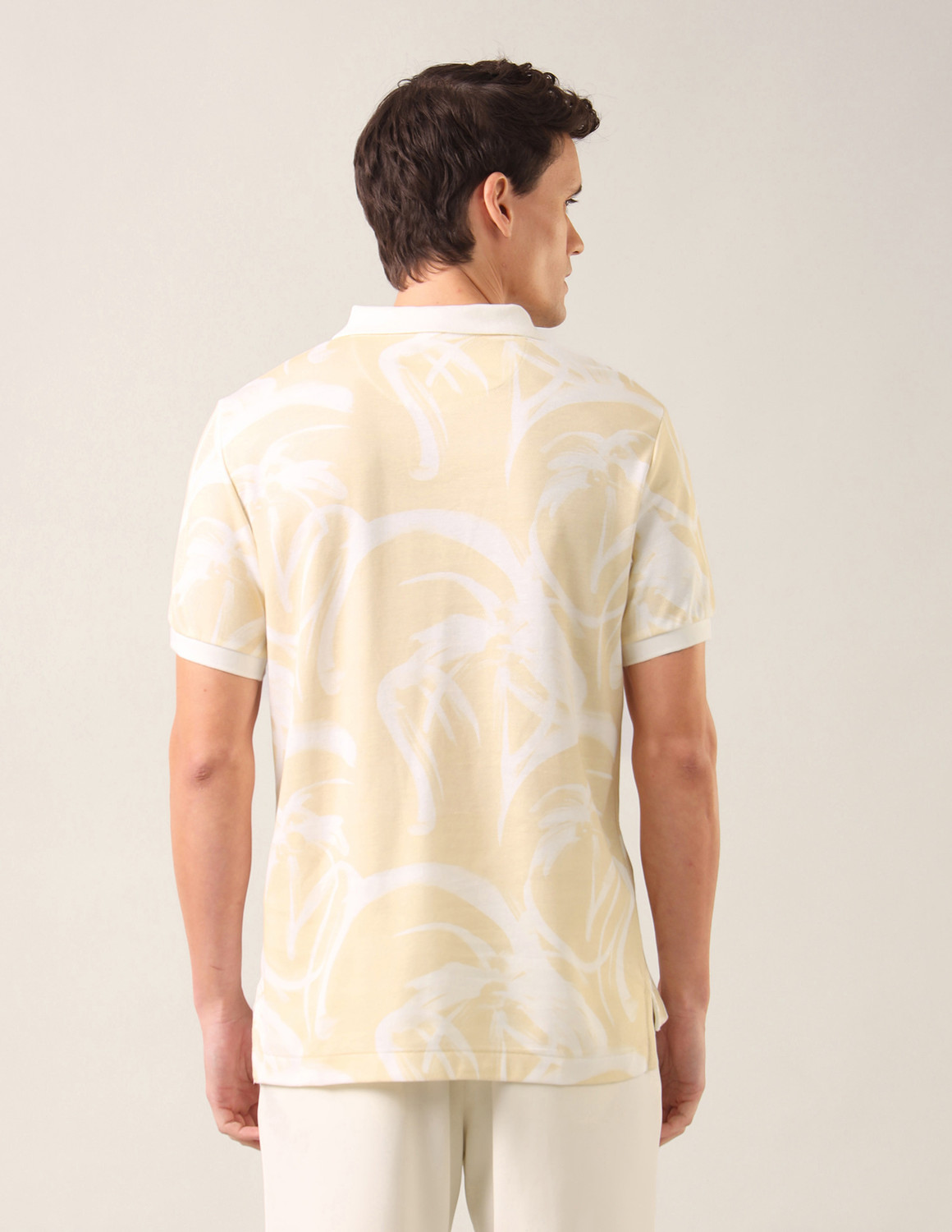 Image of U.S. Polo Assn. Denim Co. Men Printed Polo Neck Pure Cotton Beige T-Shirt