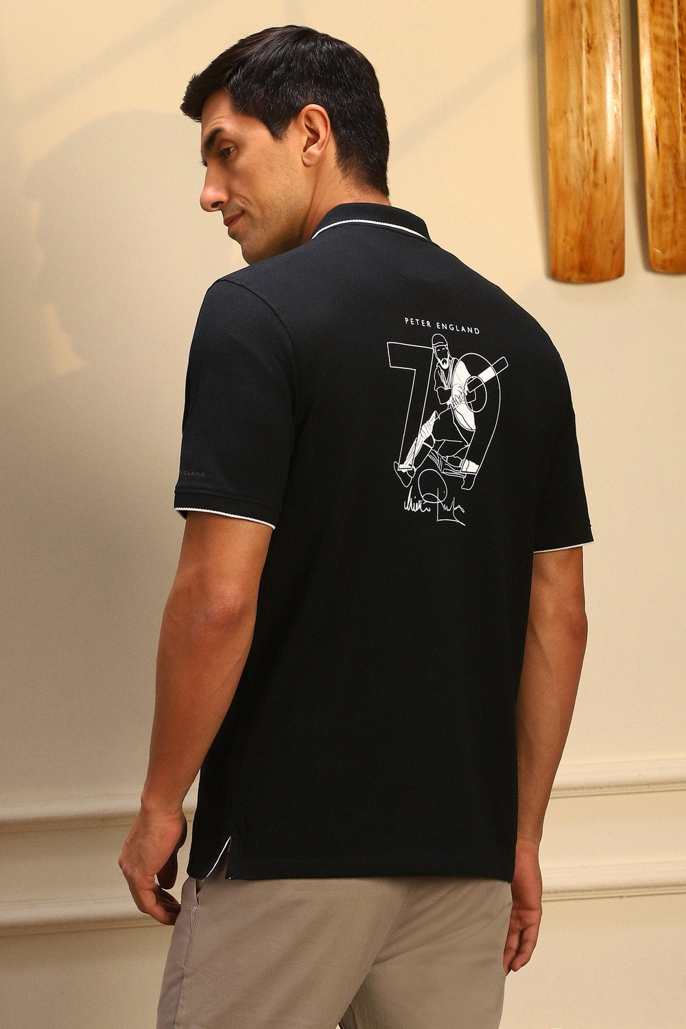 Image of PETER ENGLAND Men Self Design Polo Neck Pure Cotton Black T-Shirt