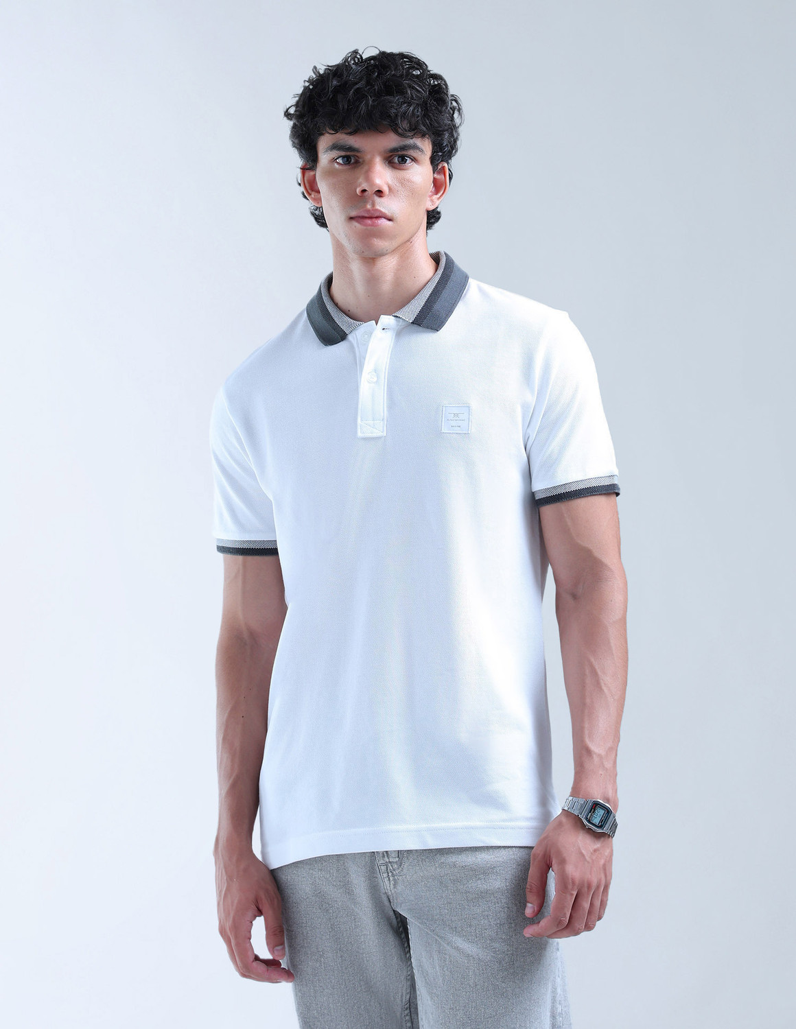 Image of FLYING MACHINE Solid Men Polo Neck White T-Shirt