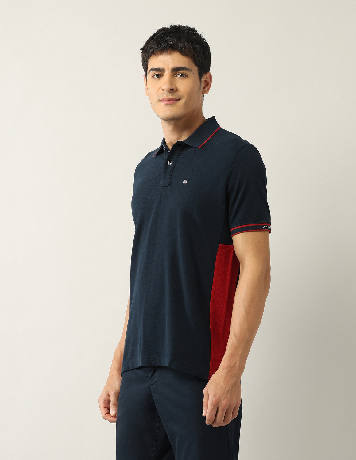 Image of Arrow Sport Solid, Colorblock Men Polo Neck Blue T-Shirt