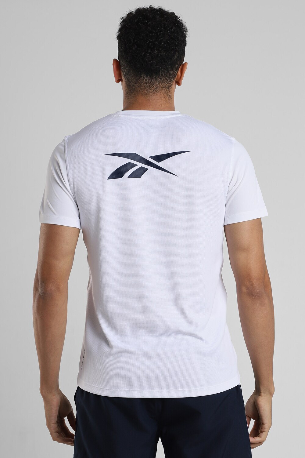 Image of REEBOK Solid Men Round Neck White T-Shirt