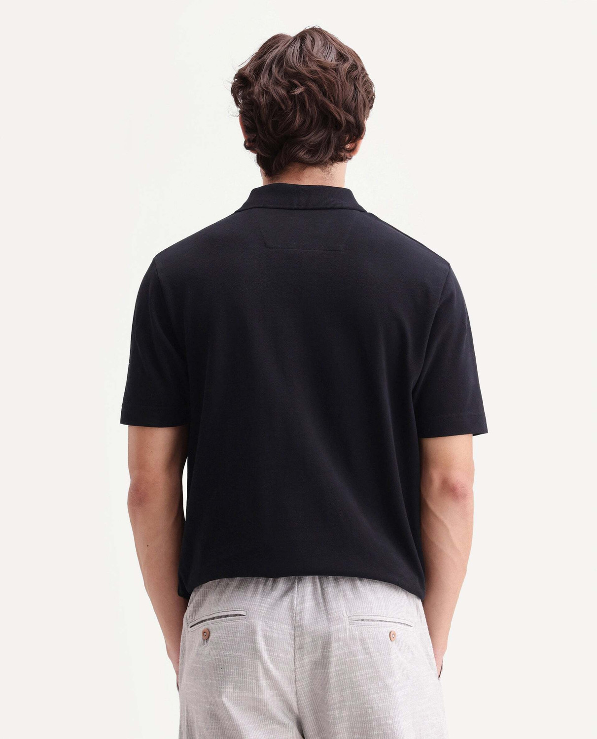 Image of RARE RABBIT Solid Men Polo Neck Black T-Shirt
