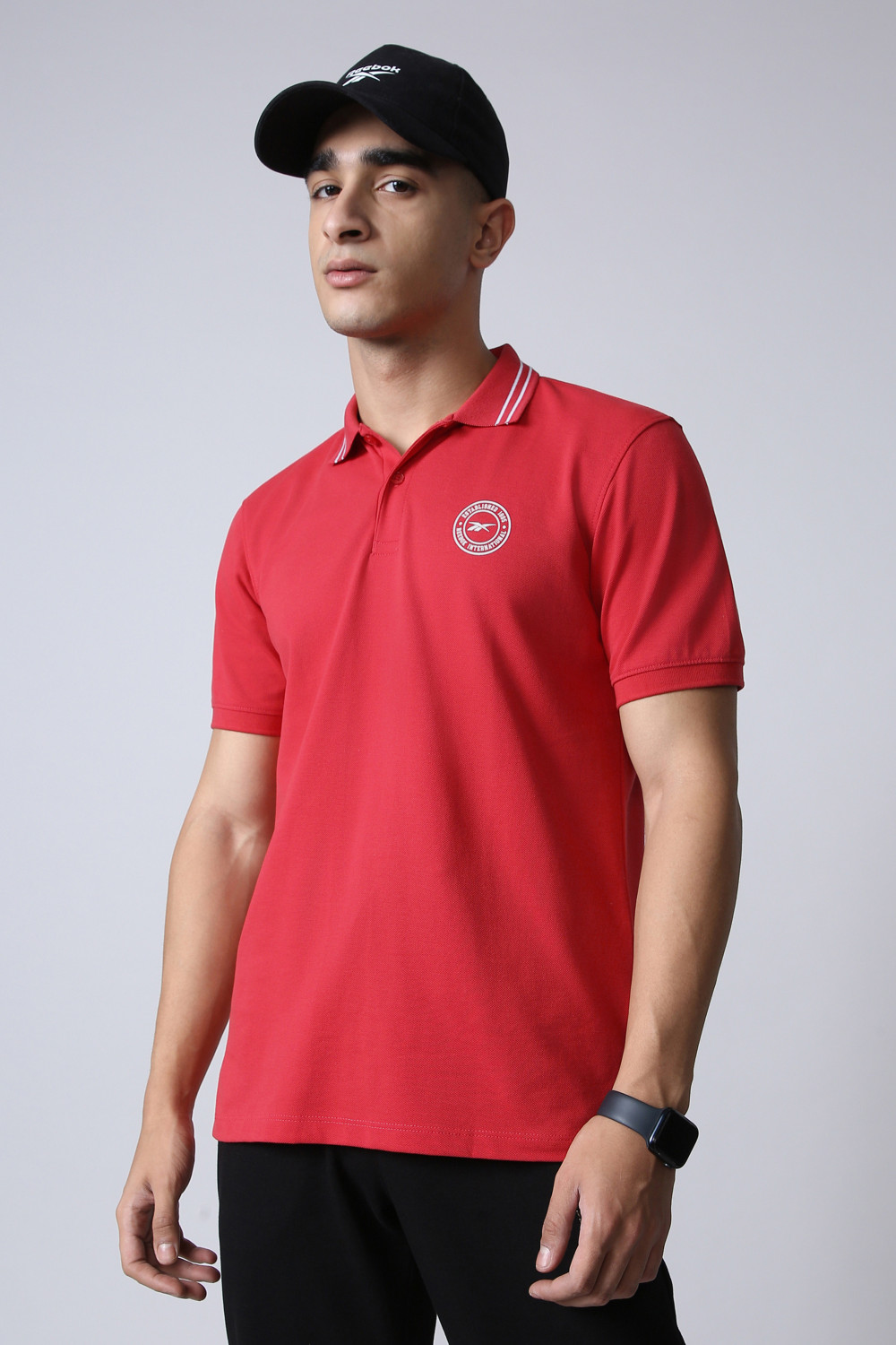 Image of REEBOK Men Solid Polo Neck Polyester Red T-Shirt