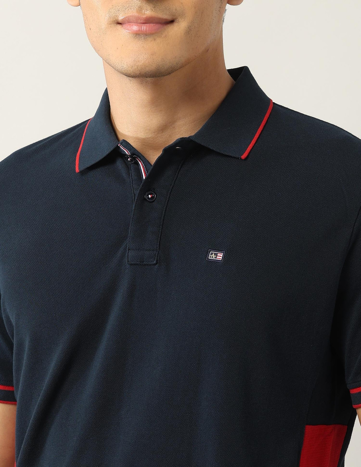 Image of Arrow Sport Solid, Colorblock Men Polo Neck Blue T-Shirt