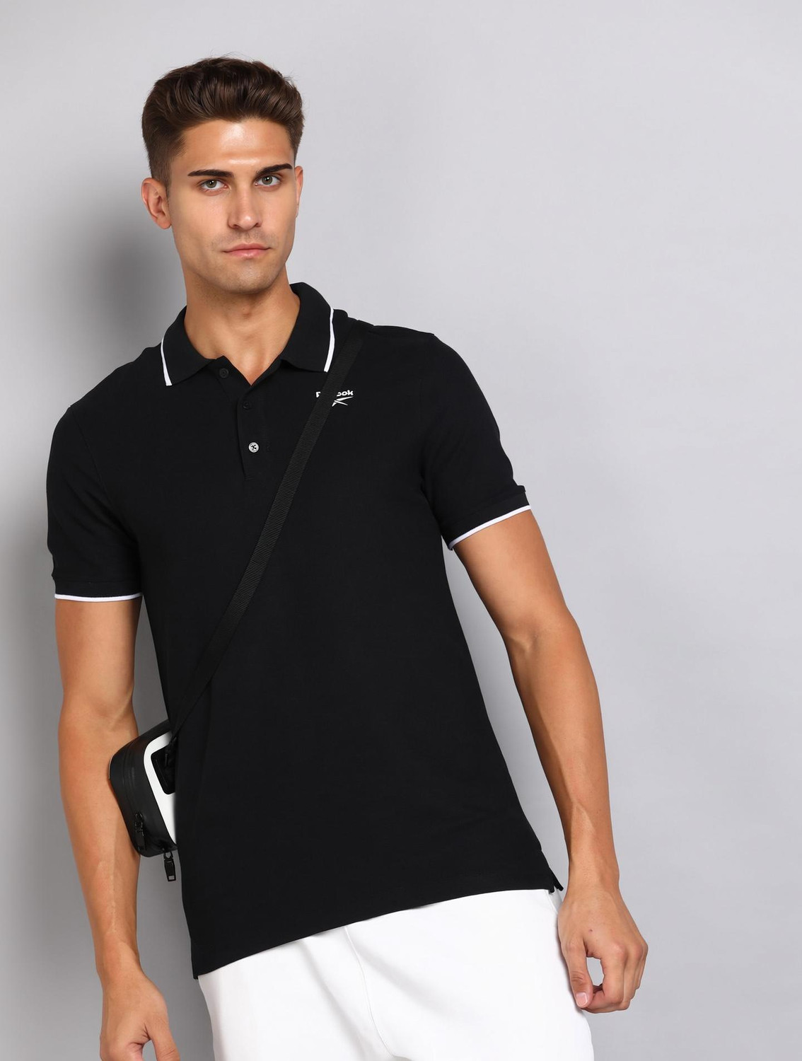 Image of REEBOK Solid Men Polo Neck Black T-Shirt