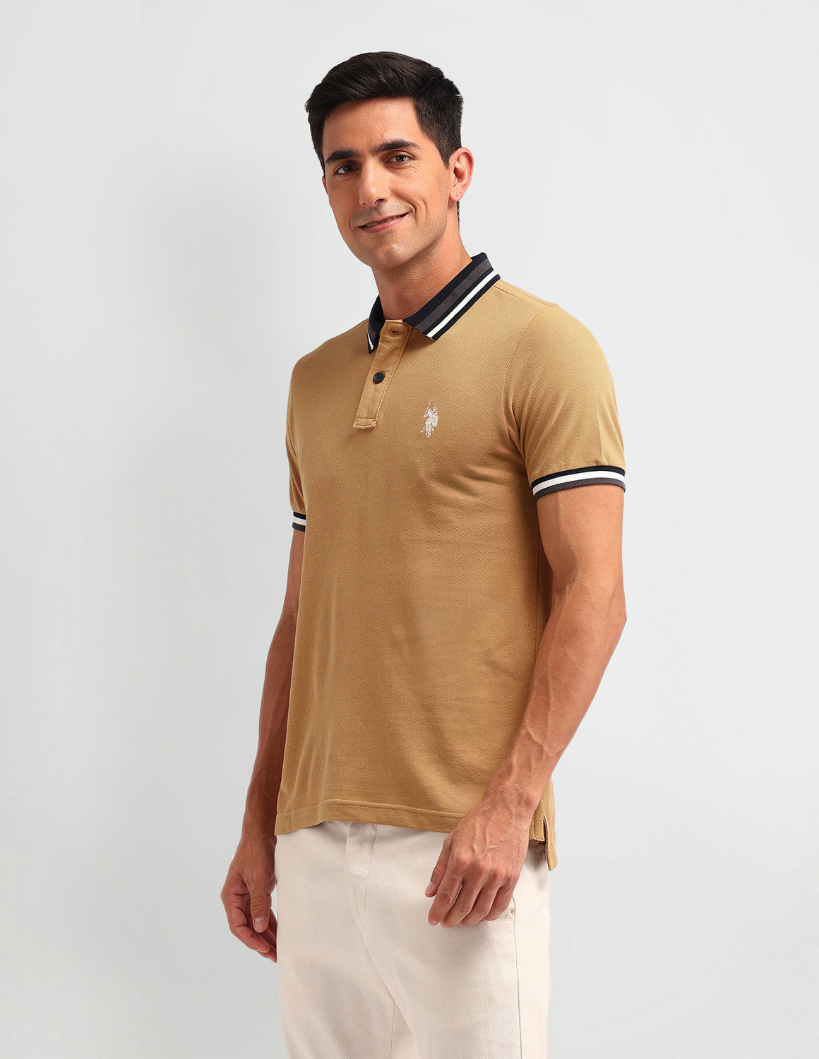 Image of U.S. POLO ASSN. Solid Men Polo Neck Brown T-Shirt