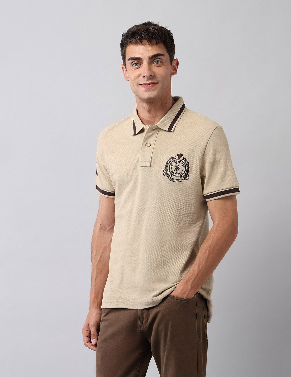 Image of U.S. Polo Assn. Denim Co. Solid Men Polo Neck Beige T-Shirt