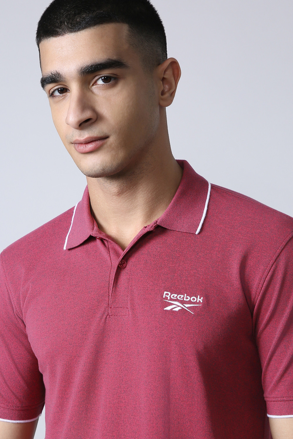 Image of REEBOK Men Solid Polo Neck Polyester Red T-Shirt