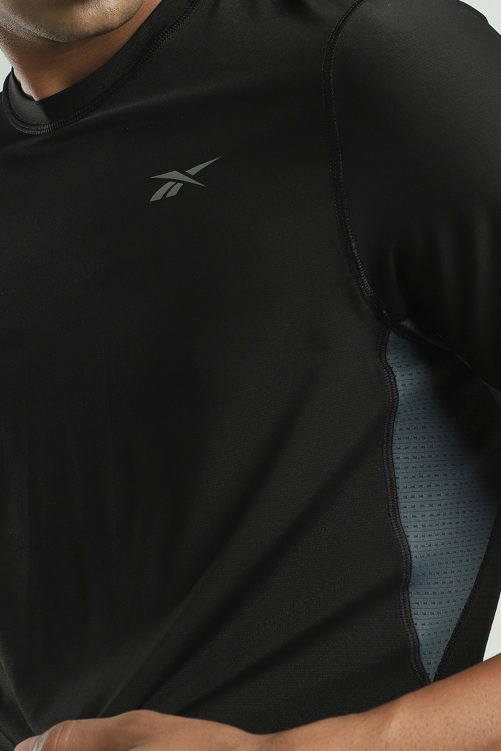 Image of REEBOK Solid Men Round Neck Black T-Shirt