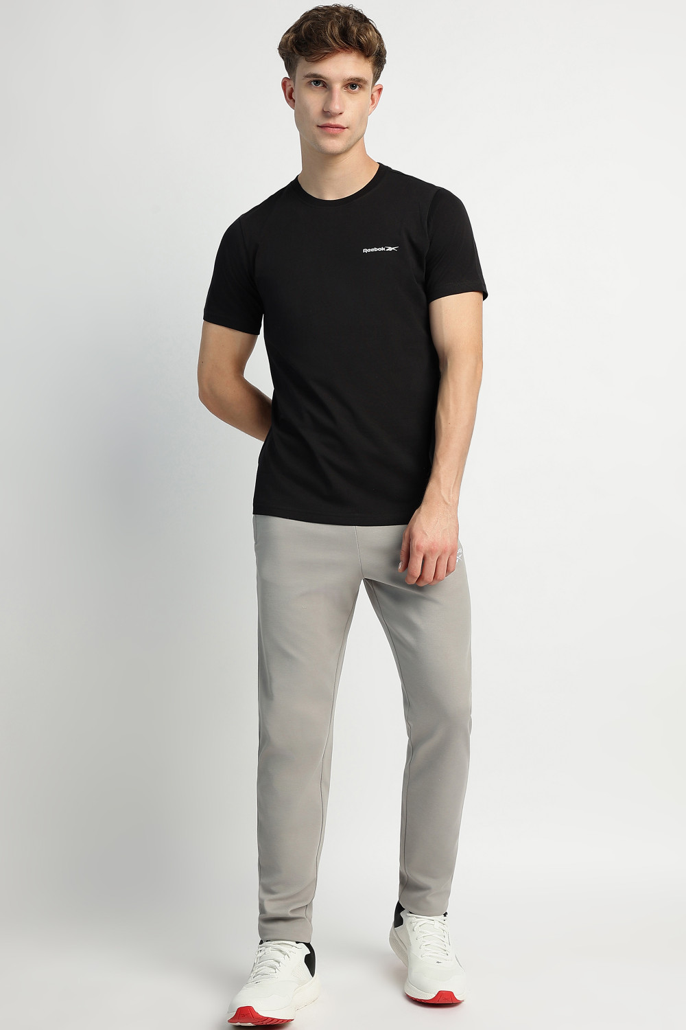 Image of REEBOK Men Solid Round Neck Pure Cotton Black T-Shirt