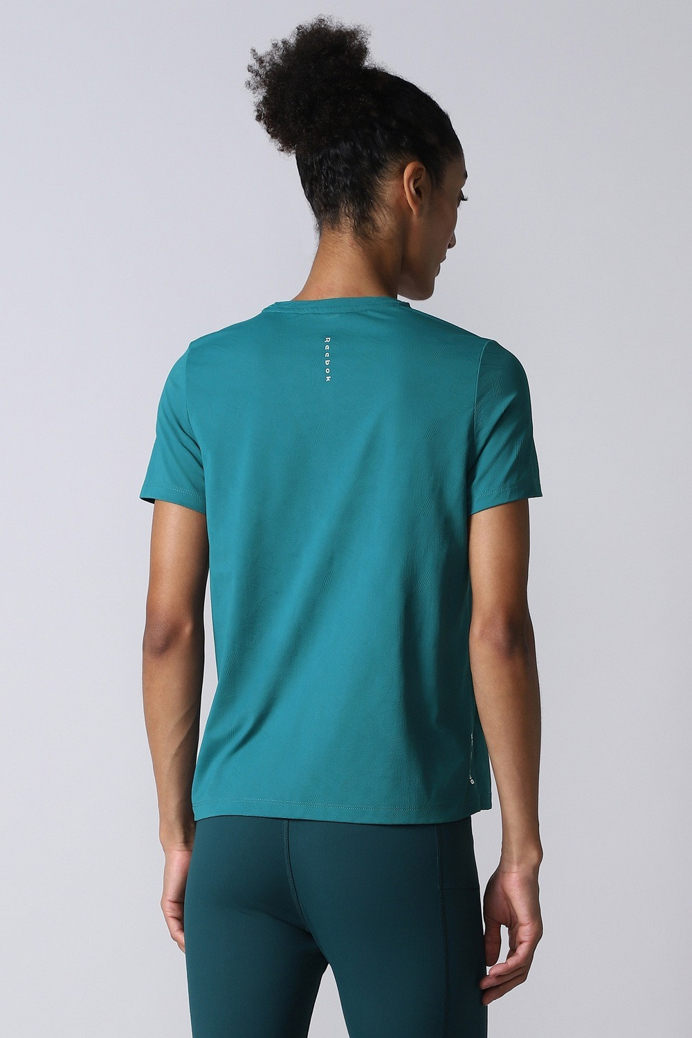 Image of REEBOK Women Solid Round Neck Polyester Blue T-Shirt
