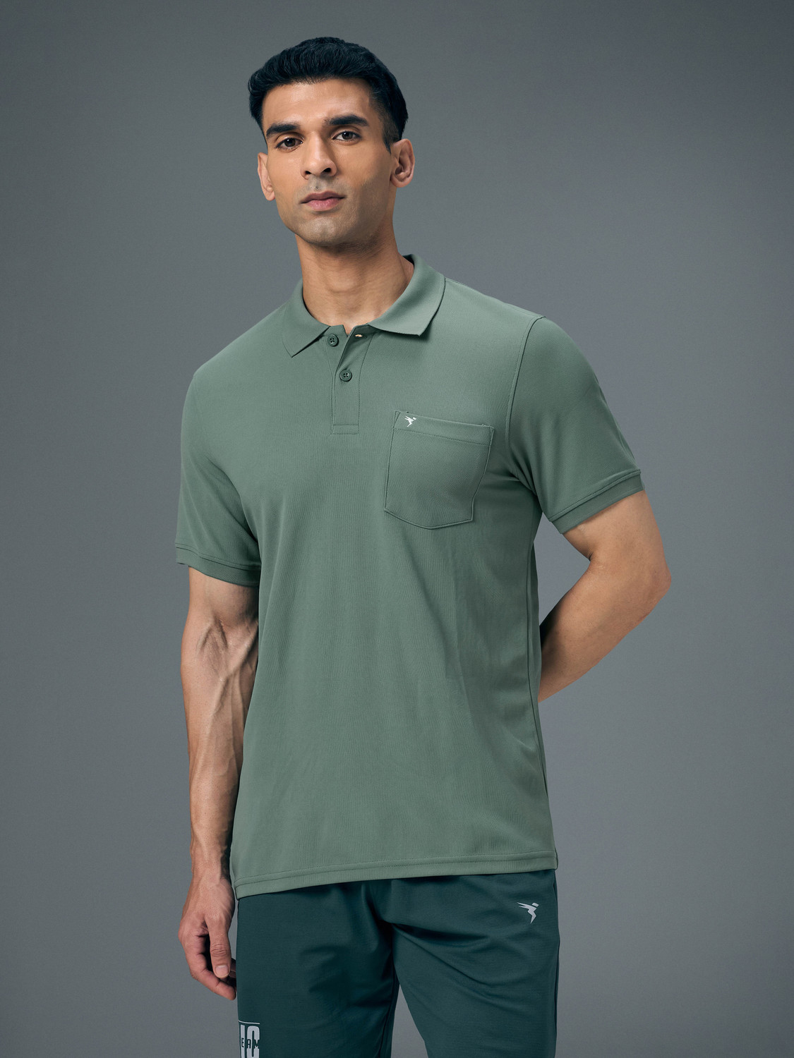 Image of TECHNOSPORT Solid Men Polo Neck Green T-Shirt