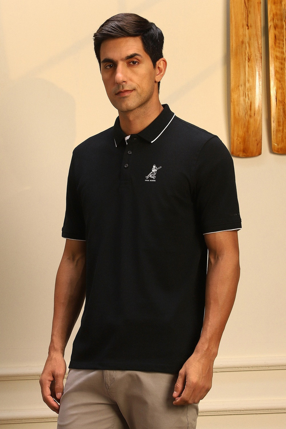 Image of PETER ENGLAND Men Self Design Polo Neck Pure Cotton Black T-Shirt