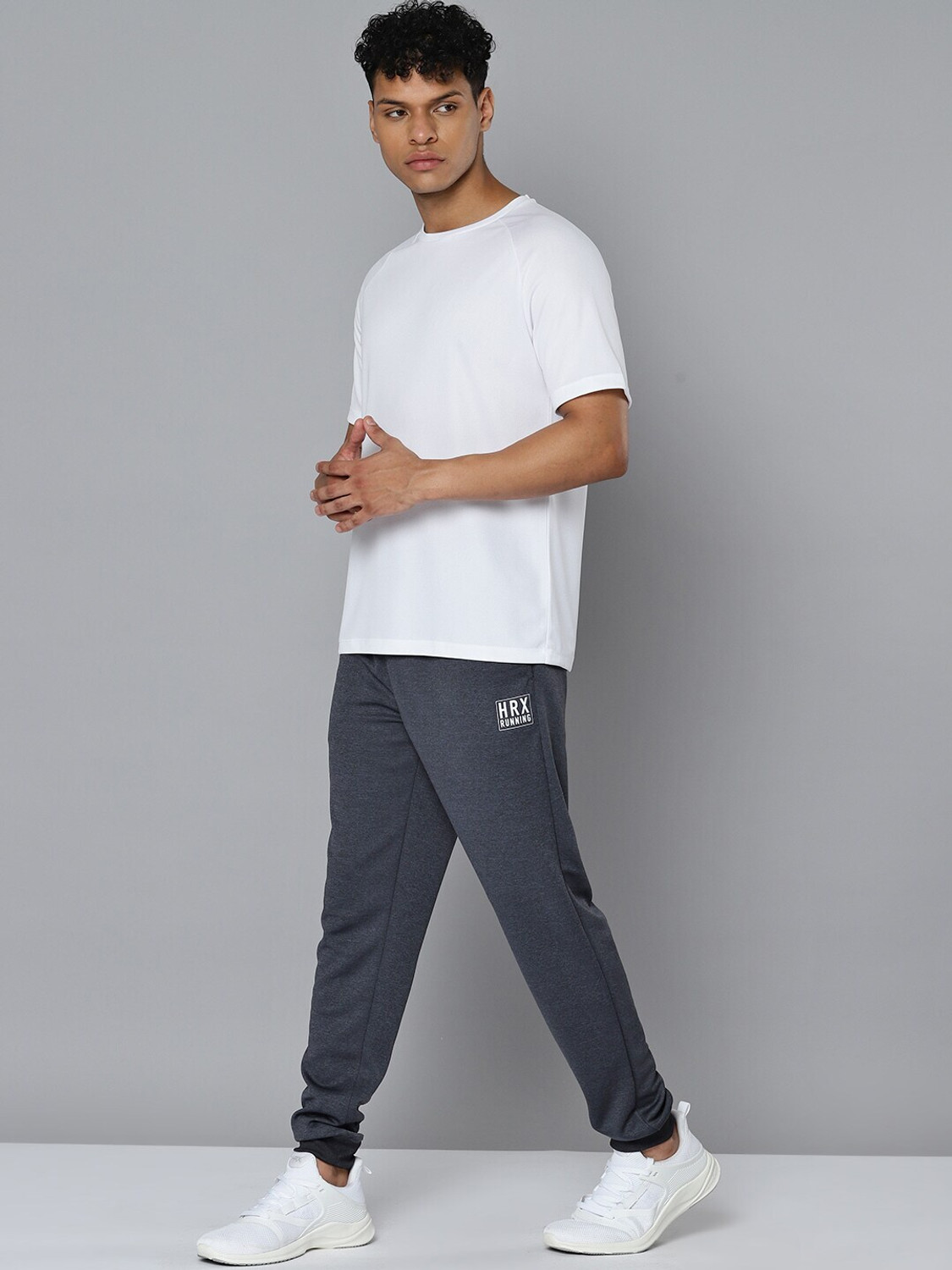 Image of HRX by Hrithik Roshan Men Solid Round Neck Polyester White T-Shirt