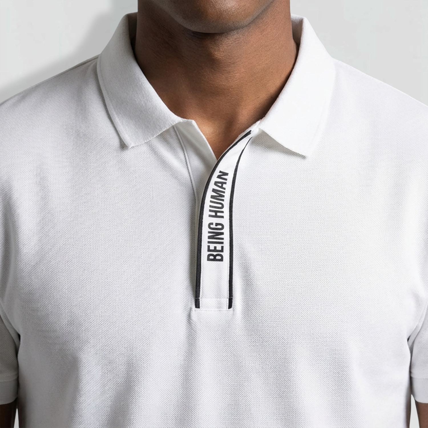 Image of BEING HUMAN Men Solid Polo Neck Cotton Blend White T-Shirt