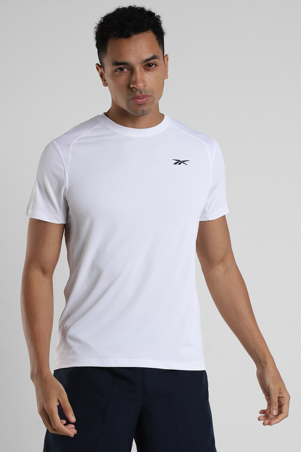 Image of REEBOK Solid Men Round Neck White T-Shirt