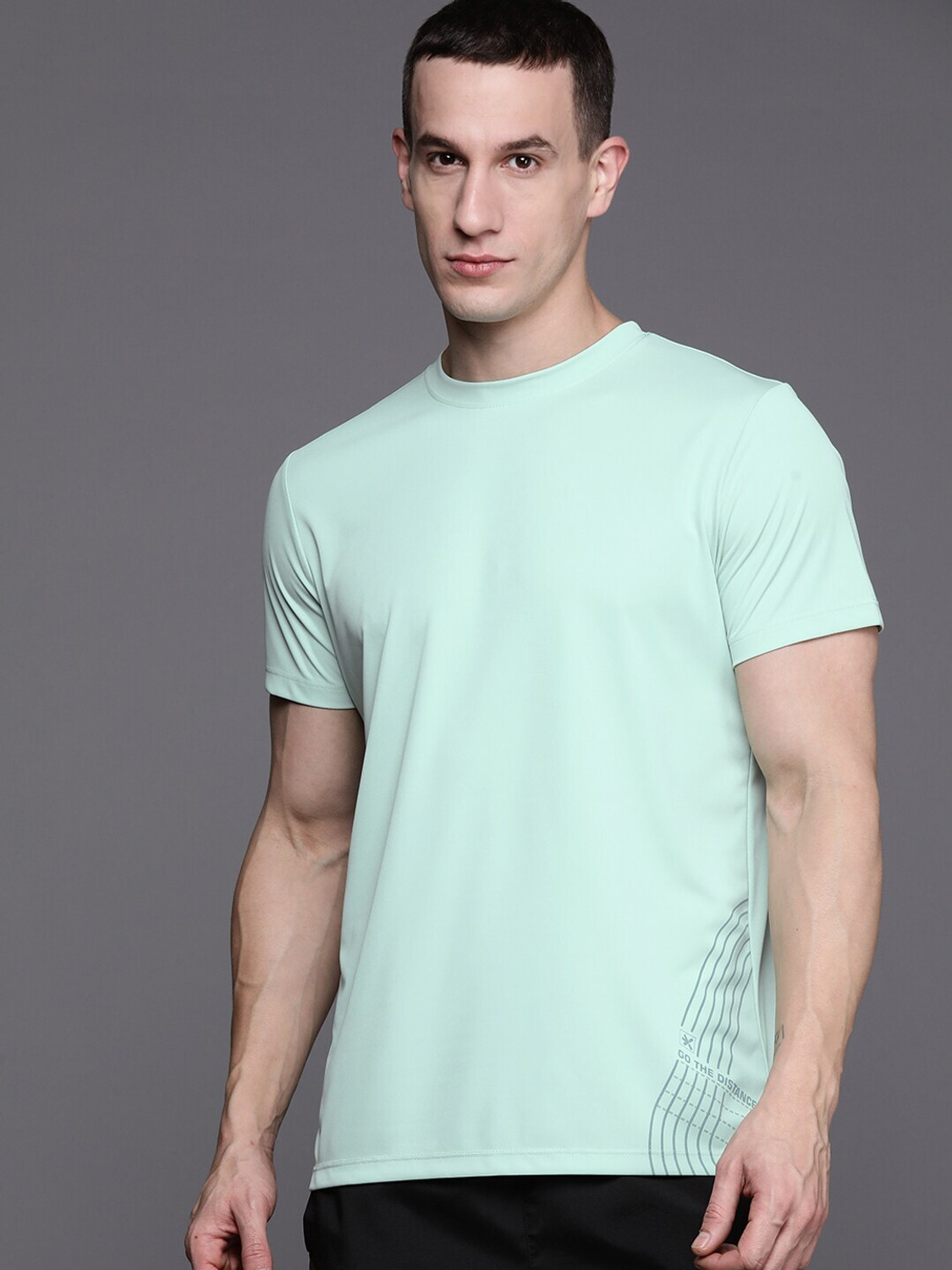 Image of HRX by Hrithik Roshan Solid Men Round Neck Green T-Shirt