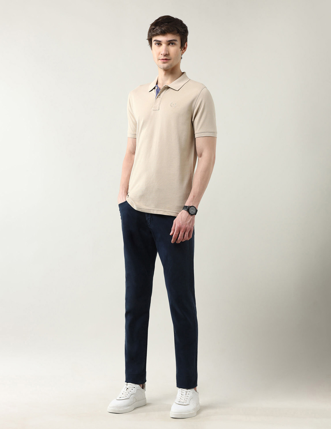 Image of Arrow Sport Solid Men Polo Neck Beige T-Shirt