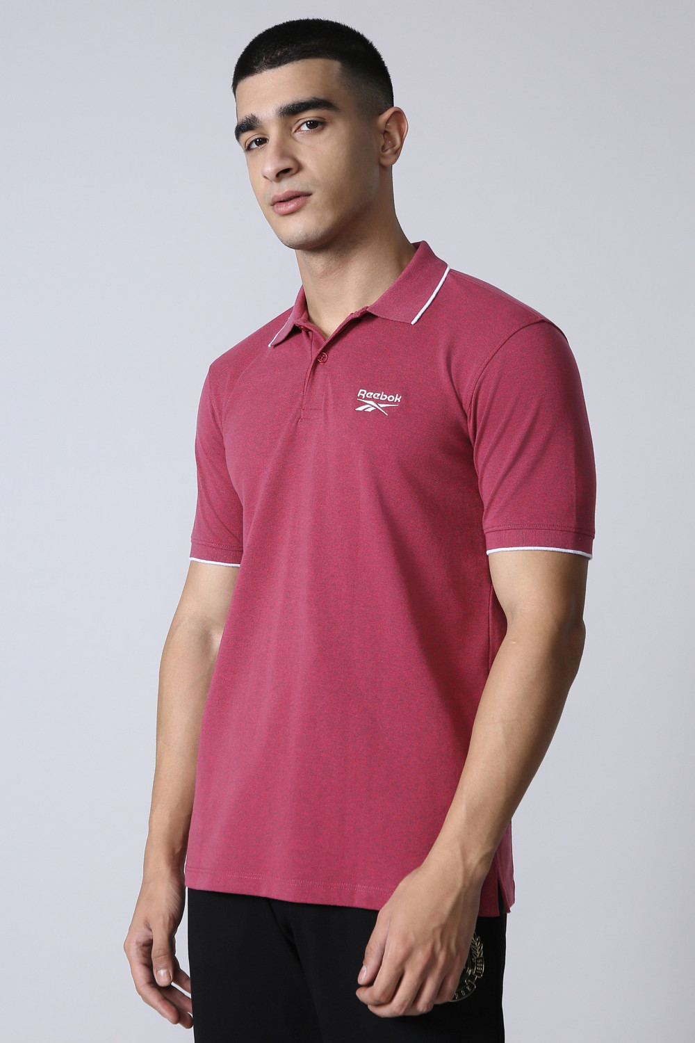 Image of REEBOK Men Solid Polo Neck Polyester Red T-Shirt