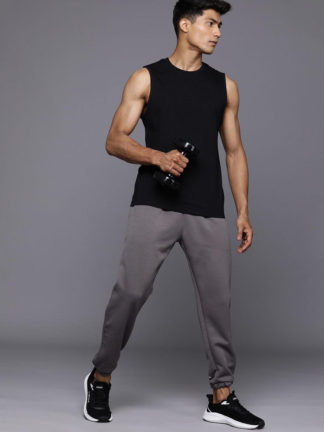 Image of HRX by Hrithik Roshan Solid Men Round Neck Black T-Shirt