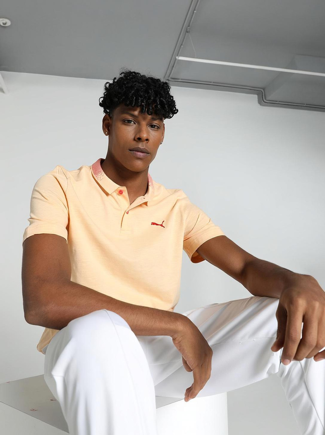 Image of PUMA Solid Men Polo Neck Orange T-Shirt