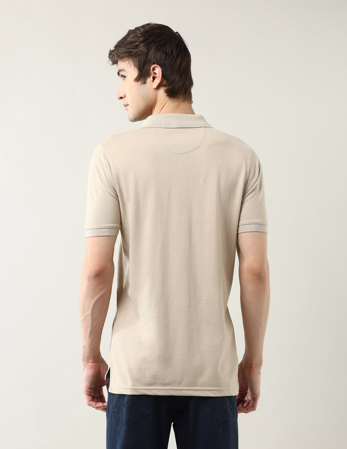 Image of Arrow Sport Solid Men Polo Neck Beige T-Shirt