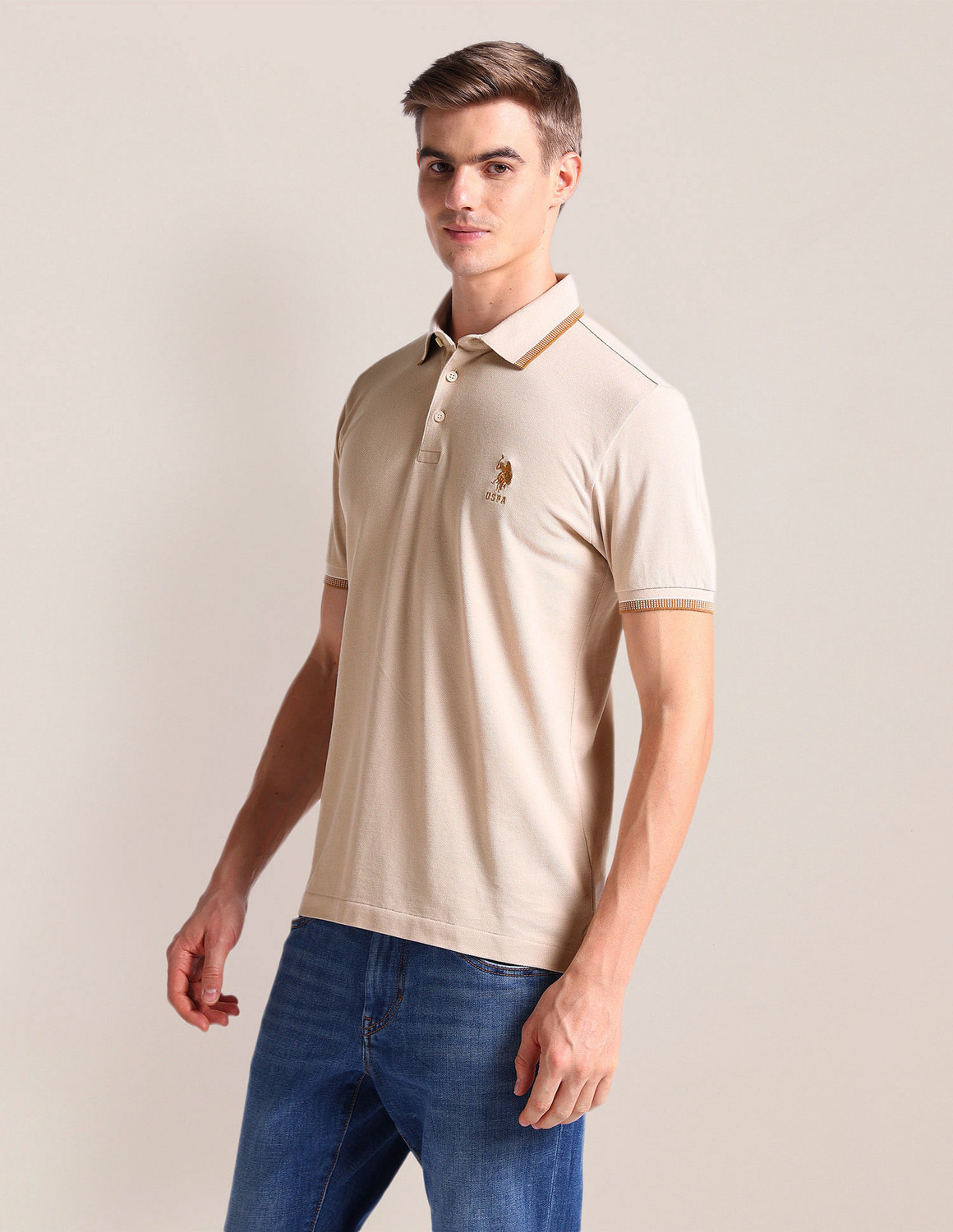 Image of U.S. POLO ASSN. Men Solid Polo Neck Cotton Blend Beige T-Shirt