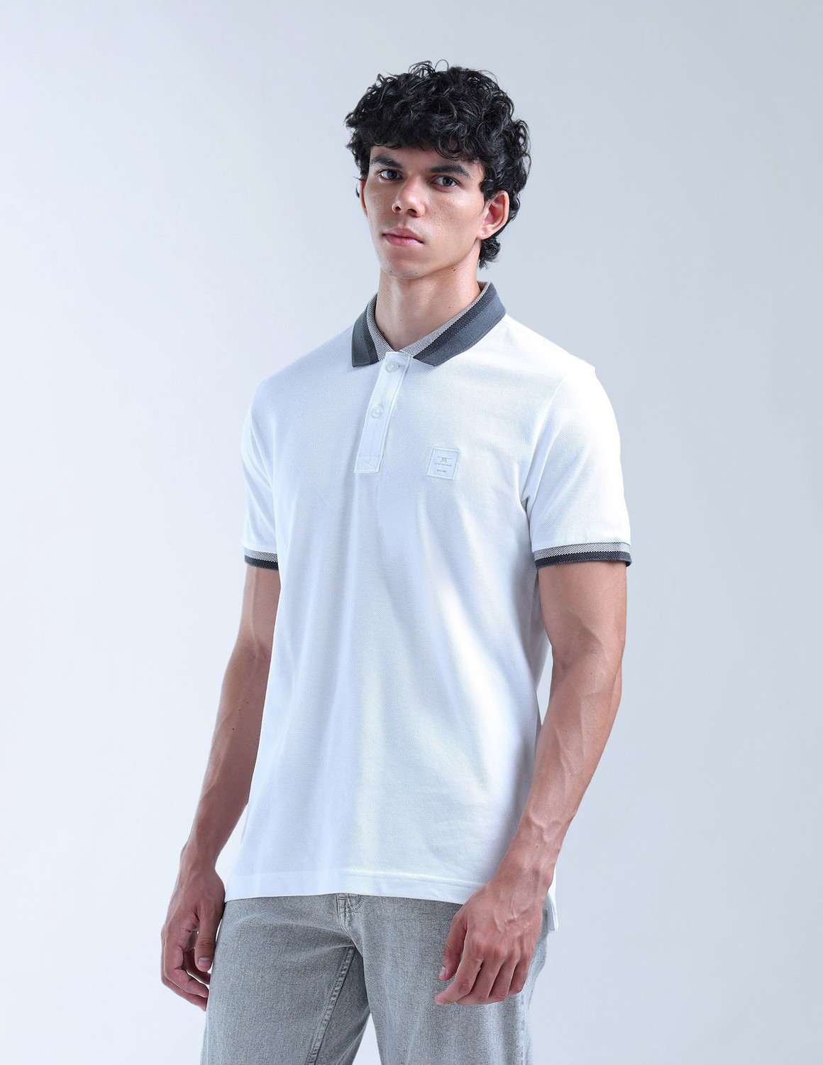 Image of FLYING MACHINE Solid Men Polo Neck White T-Shirt