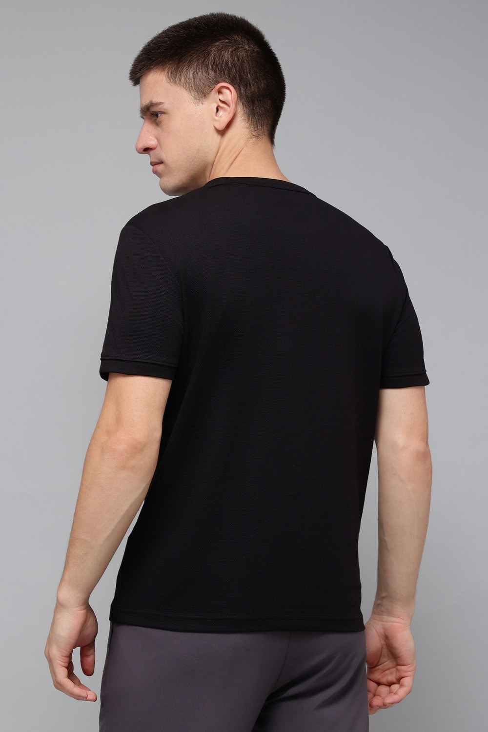Image of REEBOK Solid Men Round Neck Black T-Shirt