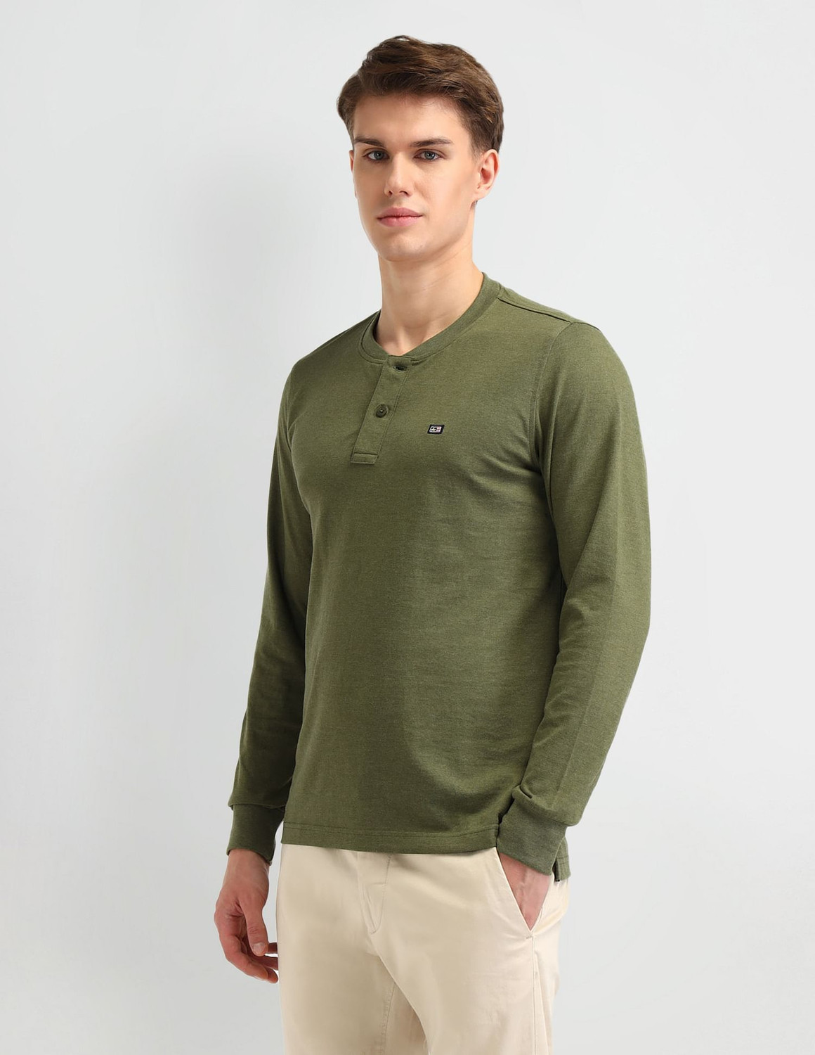 Image of Arrow Sport Solid Men Henley Neck Green T-Shirt