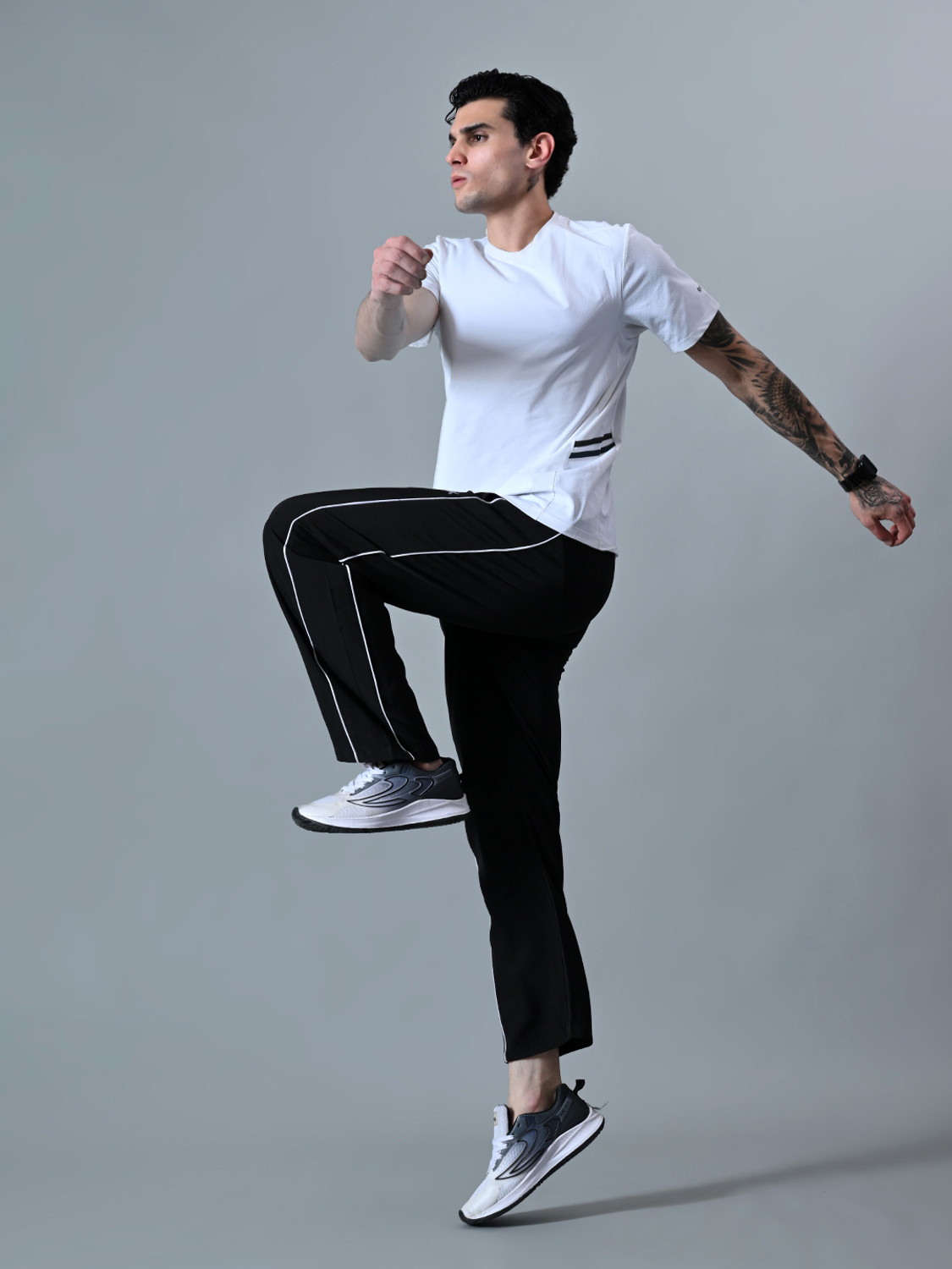 Image of HRX by Hrithik Roshan Striped Men Black Track Pants