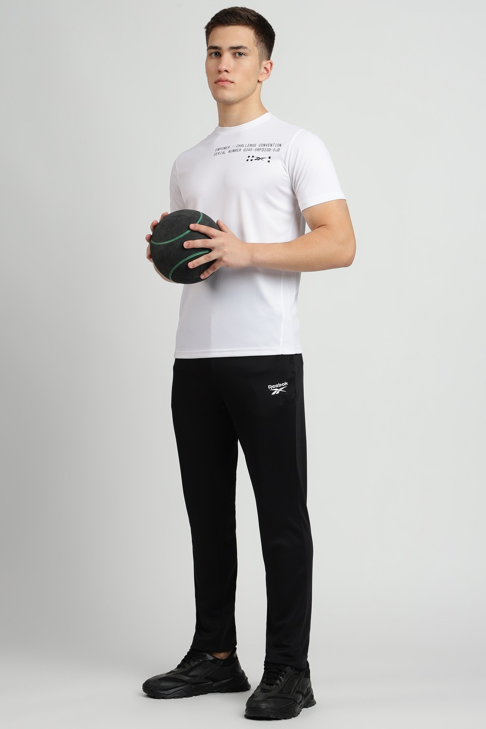 Image of REEBOK Solid Men Black Track Pants