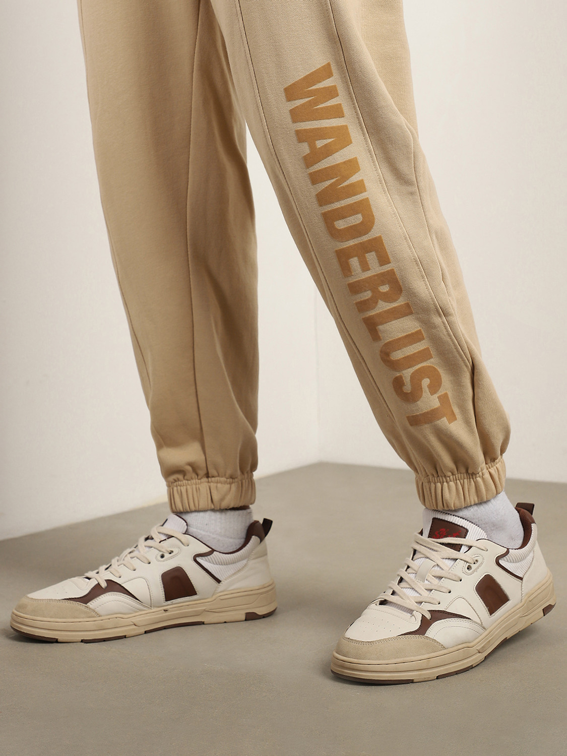 Image of NOBERO Printed Men Beige Track Pants