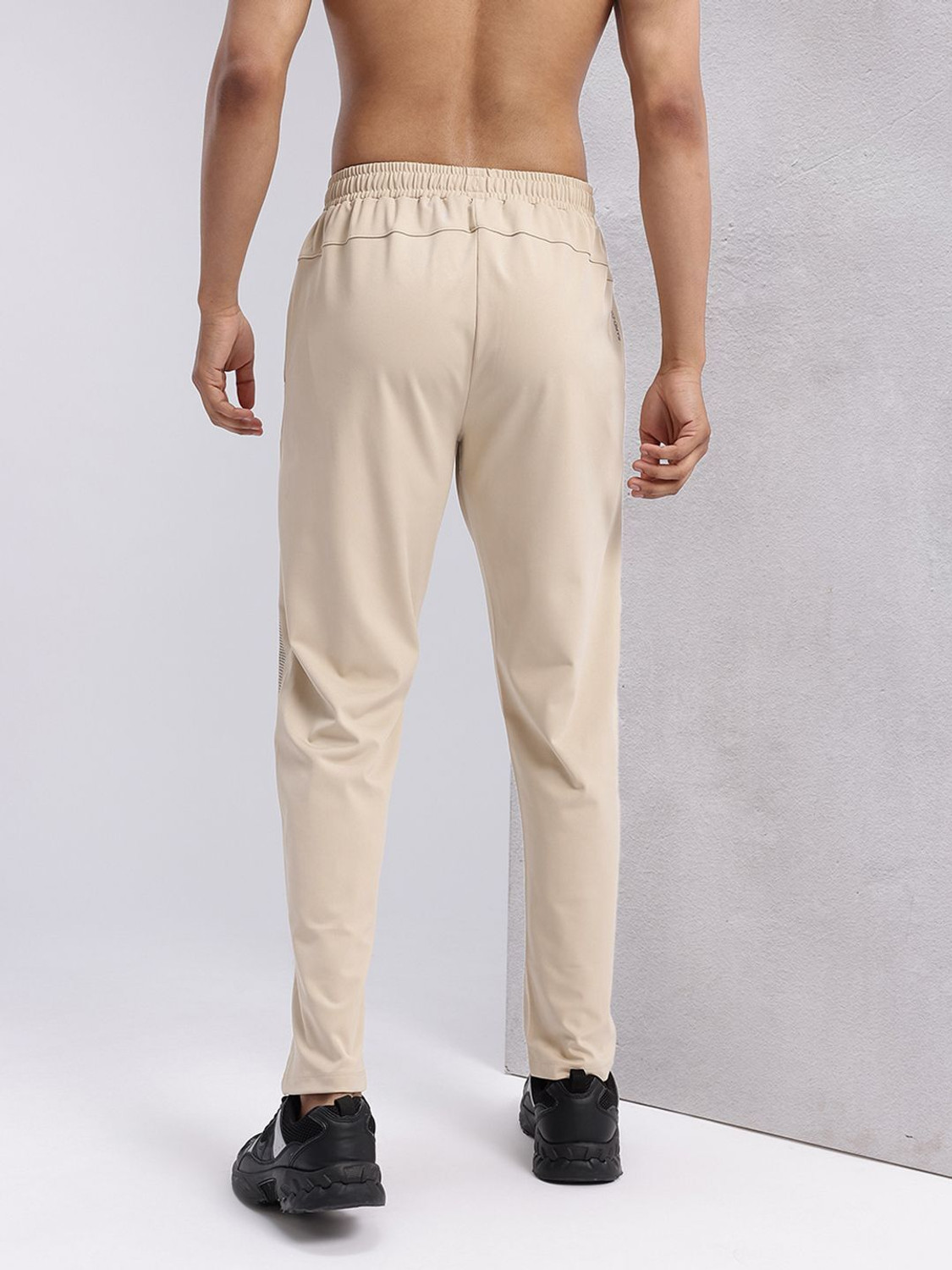 Image of HRX by Hrithik Roshan Graphic Print Men Beige Track Pants