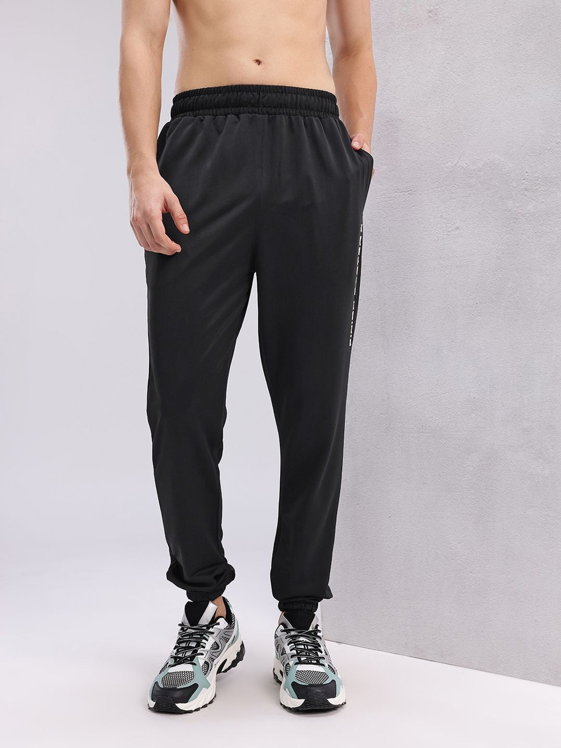 Image of HRX by Hrithik Roshan Self Design Men Black Track Pants