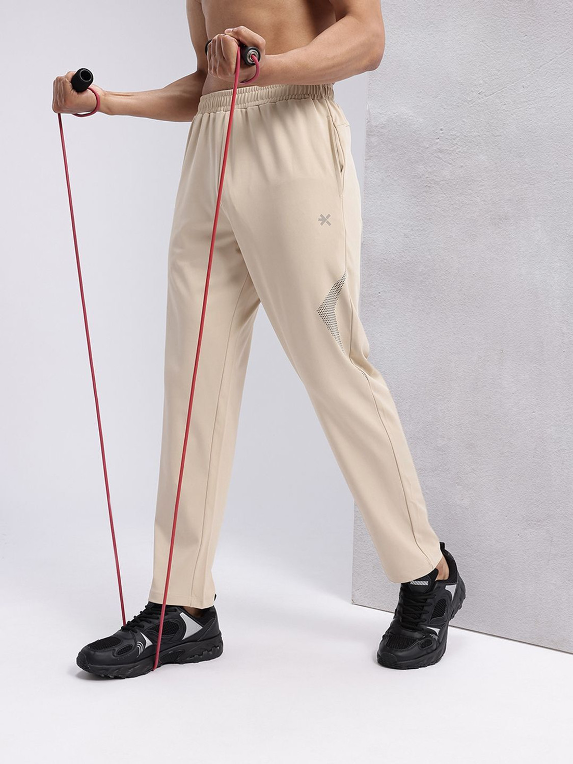 Image of HRX by Hrithik Roshan Graphic Print Men Beige Track Pants