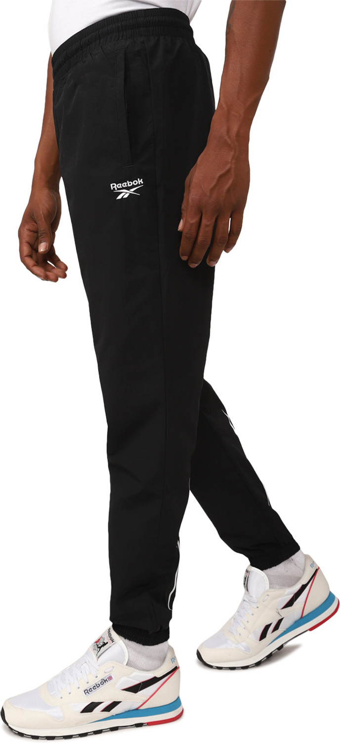 Image of REEBOK Solid Men Black Track Pants
