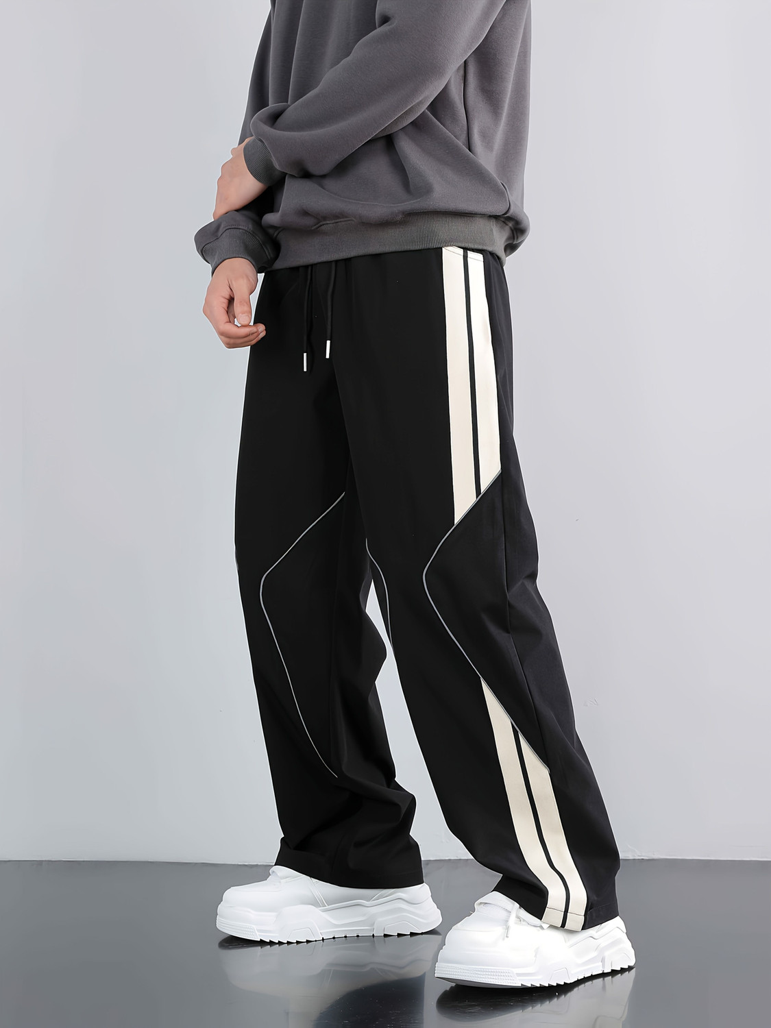 Image of JERKYN Striped Men Black Track Pants