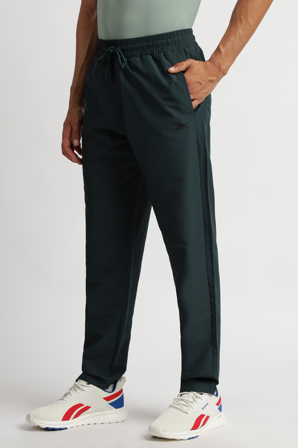 Image of REEBOK Solid Men Dark Green Track Pants