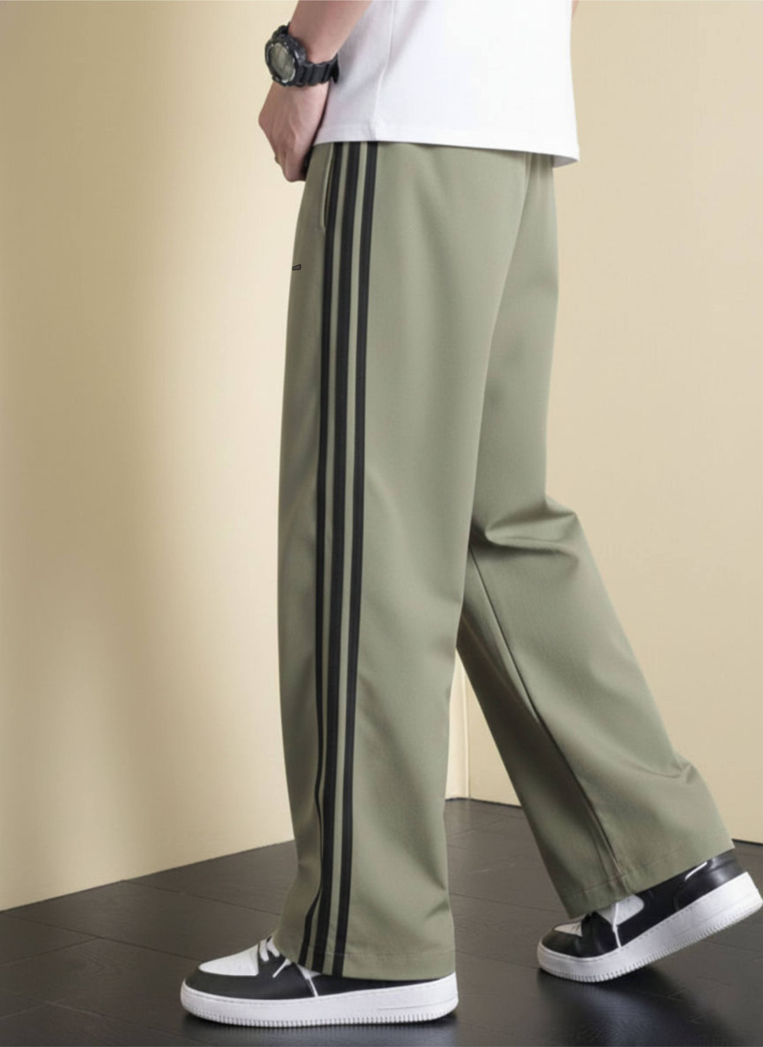 Image of LOTHRIC Striped Men Green Track Pants